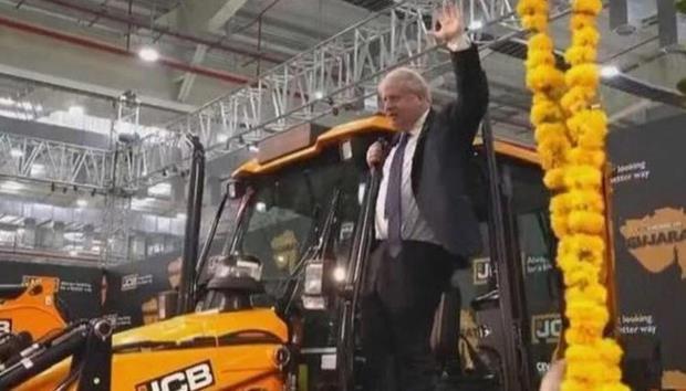 Boris Johnson India Visit, Boris Johnson on JCB, Boris Johnson on BullDozer, PM Modi Boris Johnson, PM Boris Johnson, UK PM Boris Johnson, Boris Johnson Modi Meeting, Gujarat JCB Plant, Boris Johnson Gujarat, Adani Johnson, Gautam Adani Boris Johnson, Boris Johnson on JCB Video- True Scoop